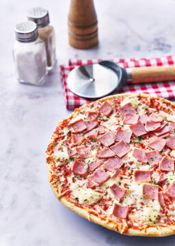  Delicious prosciutto italian pizza on a marble surface