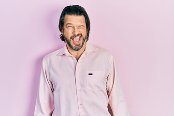 Middle age caucasian man wearing casual clothes winking looking at the camera with sexy expression, cheerful and happy face.