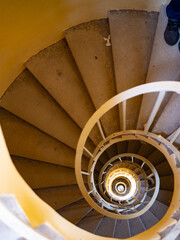 View down in Minaret tower to visitor going down by rotating stairs