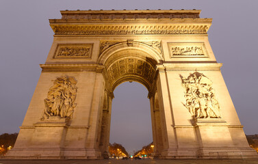 Fototapeta premium The Triumphal Arch in rainy evening, Paris, France.