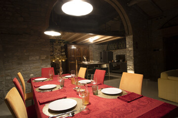 table setting for a christmas dinner in a rustic loft
