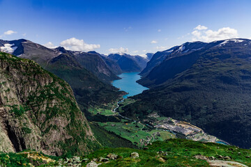 Scenic view on beautiful fjord, town and Norwegian mountains