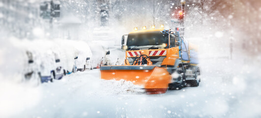 Professional snow cleaning - snow plow in the city
