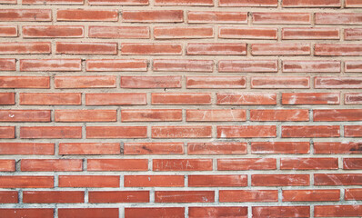 Brick wall texture with cracked tiles and cement. Classic brickwall surface background