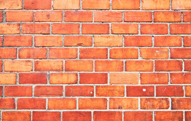 Brick wall texture with cracked tiles and cement. Classic brickwall surface background