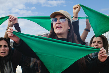Green wave abortion: Hispanic women with green scarves on reproductive rights and safe end pegnancy...