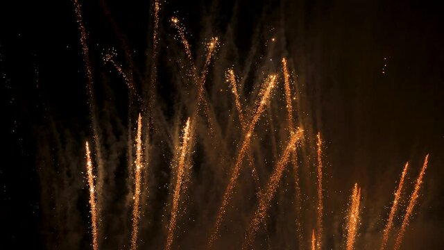 Golden firework celebration background new year. New year fireworks background holiday pattern sparkles. Celebration night holiday fireworks rocket festival background festive light golden particles