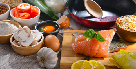 Fresh food ingredients prepared for cooking on a kitchen table