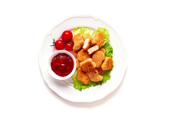 Fried chicken breast nuggets, on lettuce leaves, with tomato sauce, horizontal, no people, selective focus,