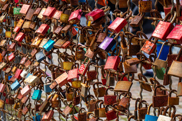A lot of locks at a fence placed as a symbol