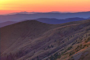 orange sunset in the mountains of Ukraine