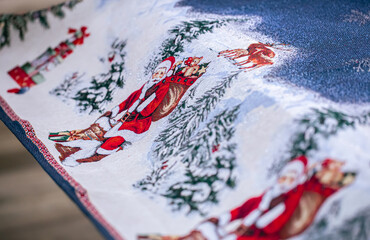Close-up of a festive Christmas tablecloth for the table.