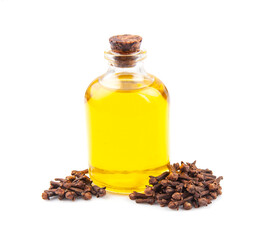 Clove essential oil in bottle and clove seed