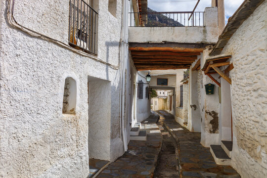 Typical street in Pampaneira, in the Alpujarras, Sierra Nevada, Granada, Spain