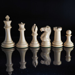 White Chess Pieces on a black background