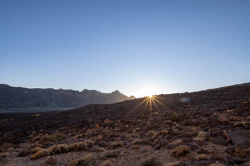 Sunset during the trekking on the Teide volcano in the natural park of tenerife. Adventure in the...