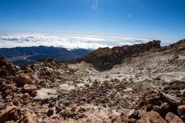 Fototapeta na wymiar Hiking and climbing in top of the mountain. Trekking experience on Teide Volcano in Canary island Tenerife. Pico del Teide climbing