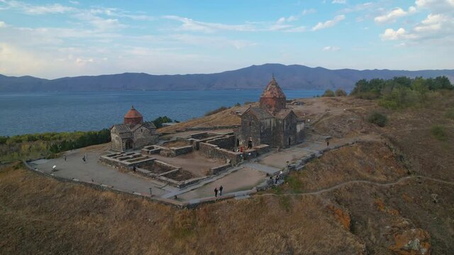 Sevanavank Monastery on Lake Sevan, Armenia. Flying around the Temple. The temple on the mountain.