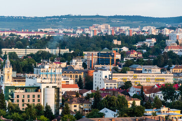 Fototapeta na wymiar Aerial view over the city on the sunset with the University of Medicine and Pharmacy. Cluj Napoca, Romania.