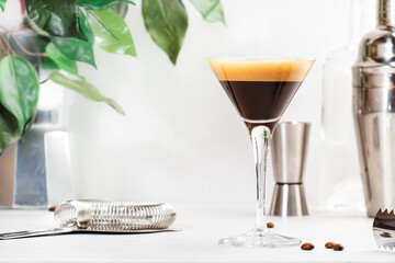 Espresso martini, trendy alcoholic cocktail with vodka, coffee liqueur, syrup and ice, black...