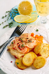 White sea fish baked with vegetables.