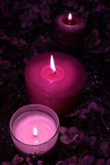 Obraz na płótnie Canvas candle burn black background light one a lot violet purple blue