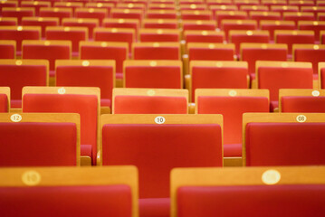 Fototapeta premium Upholstered chairs in an empty concert hall. Pandemic