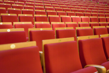 Fototapeta premium Upholstered chairs in an empty concert hall. Pandemic