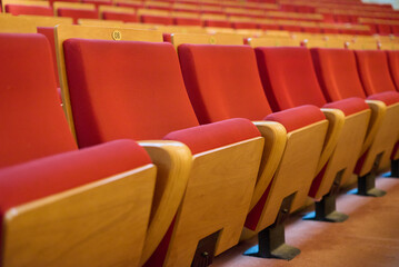 Obraz premium Upholstered chairs in an empty concert hall. Pandemic