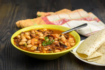Mexican style beans served with tortilla