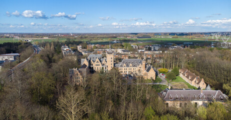 Castle Cantecroy in Mortsel Antwerp surrounded by trees seen from above. drone aerial birds eye view