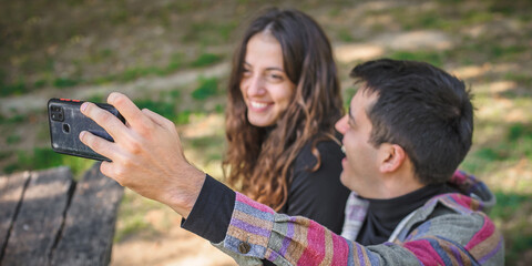 Couple in love take selfie photo with mobile phone camera
