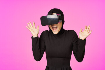 woman in black hijab glasses virtual reality technology movie watching