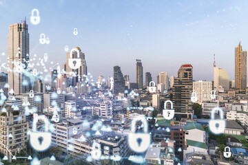 Padlock icon hologram over panorama city view of Bangkok to protect business in Southeast Asia. The concept of information security shields. Double exposure.