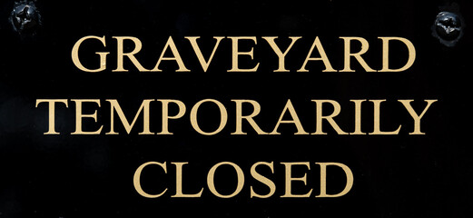 Sign reading Graveyard Temporarily Closed