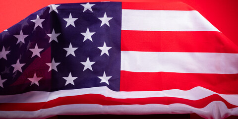 American stars and stripes flag on podium on red background
