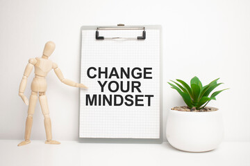 CHANGE YOUR MINDSET sign on small wood board rest on the easel with medical stethoscope