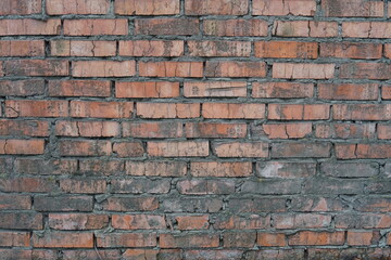 Old brick wall. Red brick wall. Red brick texture. The wall and brick were pretty beaten by time and rain.