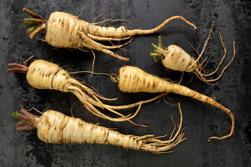 Parsnip root vegetable. White earthy vegetable roots.