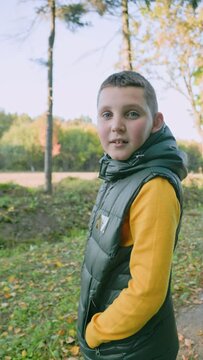 portrait of a boy in the autumn in the forest