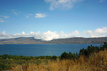 Lake Sevan in Armenia, mountains, forest and clouds