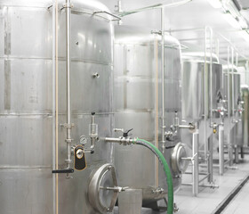 Modern brewery factory interior with reservoirs.