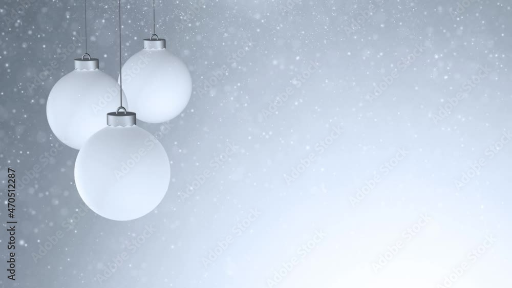 Poster white christmas baubles swing on a string with slow blurred falling snowflakes and glitter effect. c