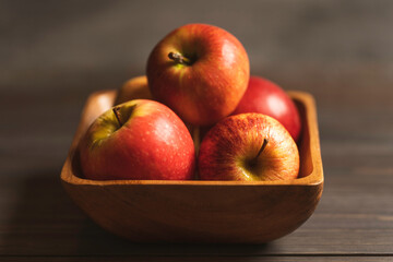 a bowl with red apples close-up