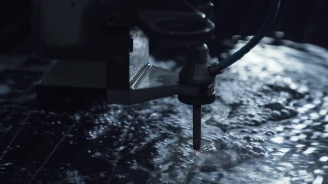 Electrolysis machine. Sparks from electric current in water close up