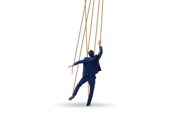 Businessman puppet being manipulated by ropes