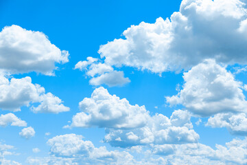Naklejka na ściany i meble White clouds on the blue sky, background