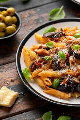 Pasta alla Norma with eggplant or aubergine, tomato, parmesan and basil. Healthy food