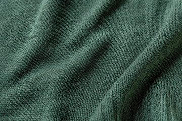 Fototapeta na wymiar abstract background of light green knit fabric texture close up