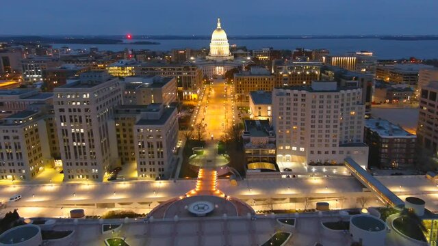 Beautiful Madison Wisconsin State Capitol Building at night, this is the people's house. Its architecture and grandeur make it easy to mistake for the US Capital, dynamic moving aerial view.
